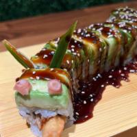 Dragon Roll · In: eel, shrimp tempura, cucumber /top: avocado with eel sauce.