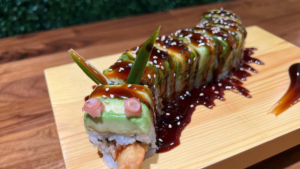 Dragon Roll · In: eel, shrimp tempura, cucumber /top: avocado with eel sauce.
