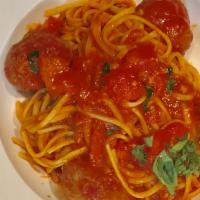 Spaghetti Con Polpette · Spaghetti with homemade meatballs and topped with house tomato sauce.