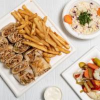 Arabic Chicken Shawarma · Succulent layer of chicken, topped with pickles and garlic sauce on special bread. Served wi...