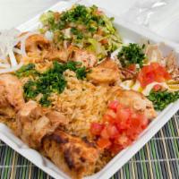 Chicken Kabab (Shish Tawook) · Two skewers of tender pieces of chicken breast served with rice, salad, hummus, garlic sauce...