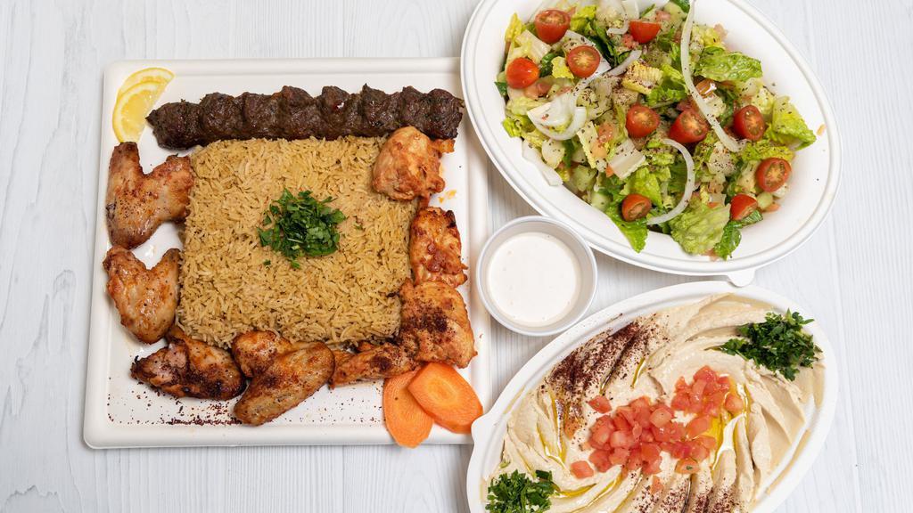 Mixed King Grill · One skewer of chicken kabab (tawook) and two skewers of kofte kabab served with rice, baba ganoush, salad tahini sauce and pita bread.