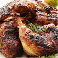 Jerk Chicken Dark Meat · Marinated in Judy’s special jerk seasoning then charred. Your choice of mild or spicy.