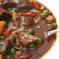 Jamaican Stew Beef · Savory beef chunks spiced with Judy’s special seasonings in a rich brown stew gravy.