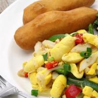 Ackee & Saltfish · Jamaica’s National Dish. Salt cod is sautéed with boiled ackee, onions, scotch bonnet pepper...