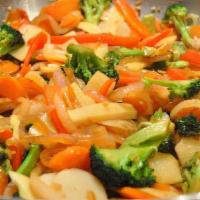 Veggie Stir Fry · Sautéed vegetables with a hint of soy sauce and garlic, rice and peas or Jasmine rice and tw...