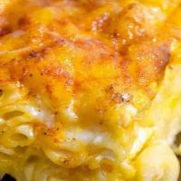 Baked Mac & Cheese · Macaroni elbows baked with Judy’s special cheese sauce.