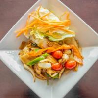 Drunken Noodle · Made with a good deal of spicy heat - flat rice noodles stir fried with fresh basil, tomatoe...