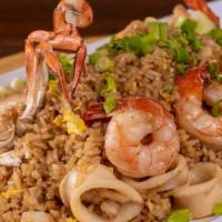 Chaufa De Mariscos · A Chinese-Peruvian seafood fried rice fusion. Accompanied with mussels, shrimps, calamari, a...