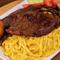 Tallarin A La Huancaina Con Bistek · Tender seasoned steak with rich yellow Ají pepper and cheese sauce on linguine. Accompanied ...