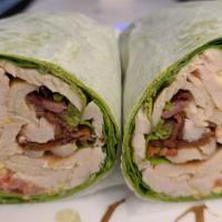 Deluxe Turkey Wrap · Roasted turkey, spinach, tomato, bacon, avocado, cheddar cheese with honey mustard in a wrap.