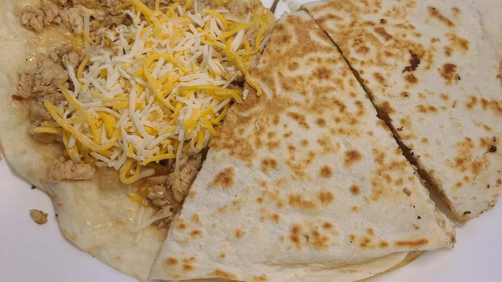 Chicken/Beef Quesadilla  · Grilled chicken or steak, roasted red pepper, onion, cheddar cheese, chiptole mayo in a wrap.