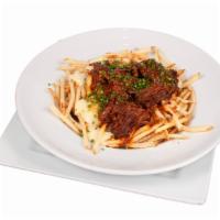 Short Rib Poutine · Fries baked with Braised “Oaxacan Style” Short Rib, White Cheddar Cheese Curds, Chives and H...