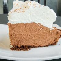 Mexican Chocolate Mousse Pie · Chocolate graham-cracker crust, spiced chocolate mousse, and fresh whipped cream. Serves 8.