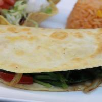 Spinach Quesadilla · Large flour tortilla filled with grilled spinach, onions, and bell peppers. Served with whit...