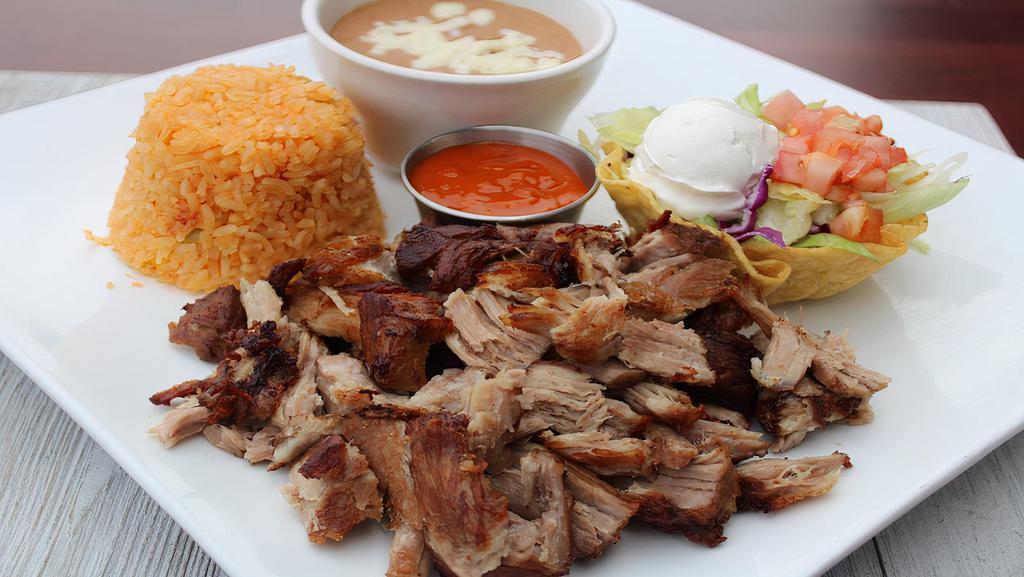 Carnitas · Ten ounce seasoned pork sliced into chunks and slow-cooked, which originated from the state of michoacán, Mexico. Served with rice, beans and crema salad. Tortillas of your choice.