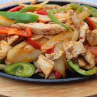 Chicken Fajitas · Served with onions, bell peppers, beans, and rice: garnished with lettuce, pico de gallo, so...