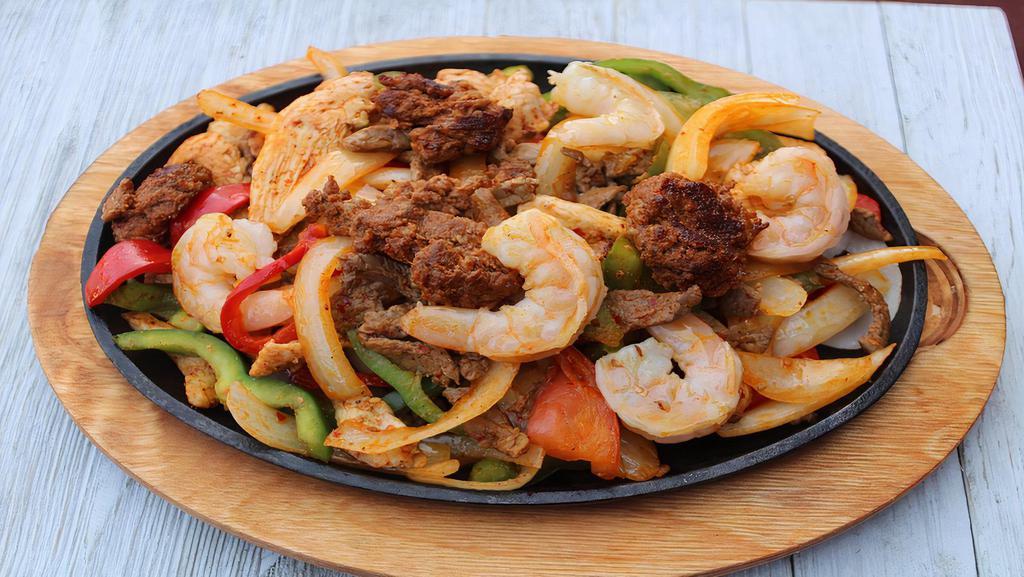 Mama'S Fajita · A delicious fajita combo of steak, chicken, shrimp, and chorizo (Mexican Sausage). One of the favorites. Served with onions, bell peppers, beans, and rice: garnished with lettuce, pico de gallo, sour cream, guacamole, and flour or corn tortillas.