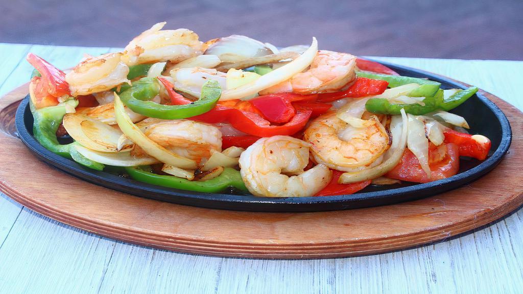 Shrimp Fajitas · Served with onions, bell peppers, beans, and rice: garnished with lettuce, pico de gallo, sour cream, guacamole, and flour or corn tortillas.