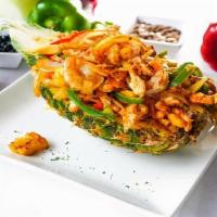 Fajita Piña · This phenomenal fajita comes to your table in a fresh pineapple half scooped out and filled ...