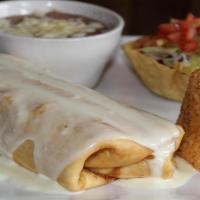 Chimichanga · Fried or soft flour tortilla, filled with beef or chicken. Served with rice, beans and crema...
