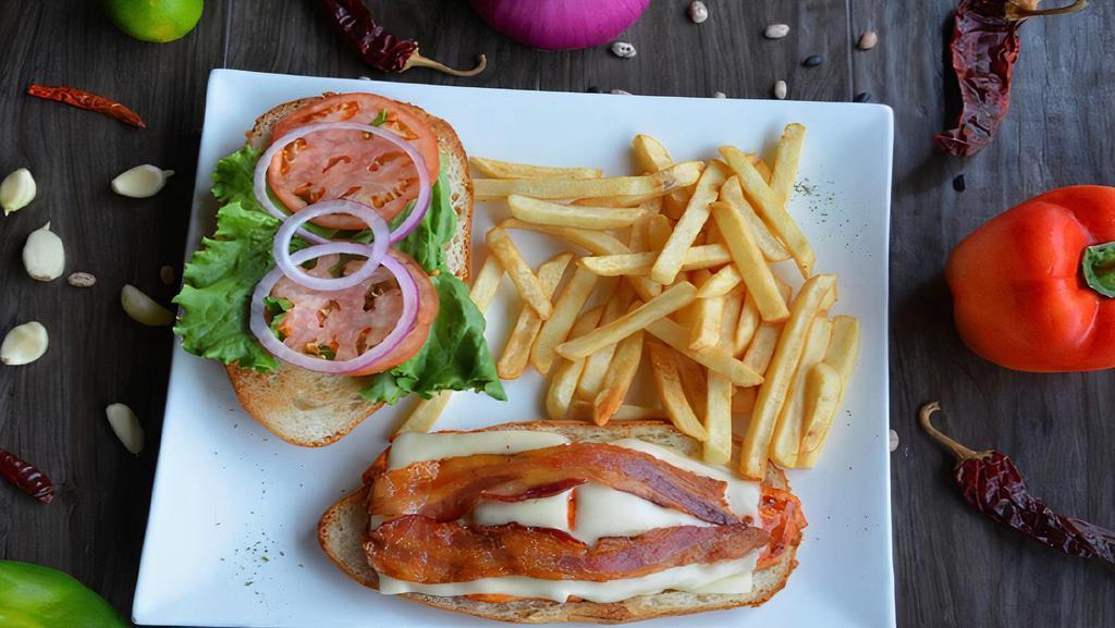 New Chicken Club · Grilled boneless chicken breast topped with crispy bacon, lettuce, tomatoes and swiss cheese.