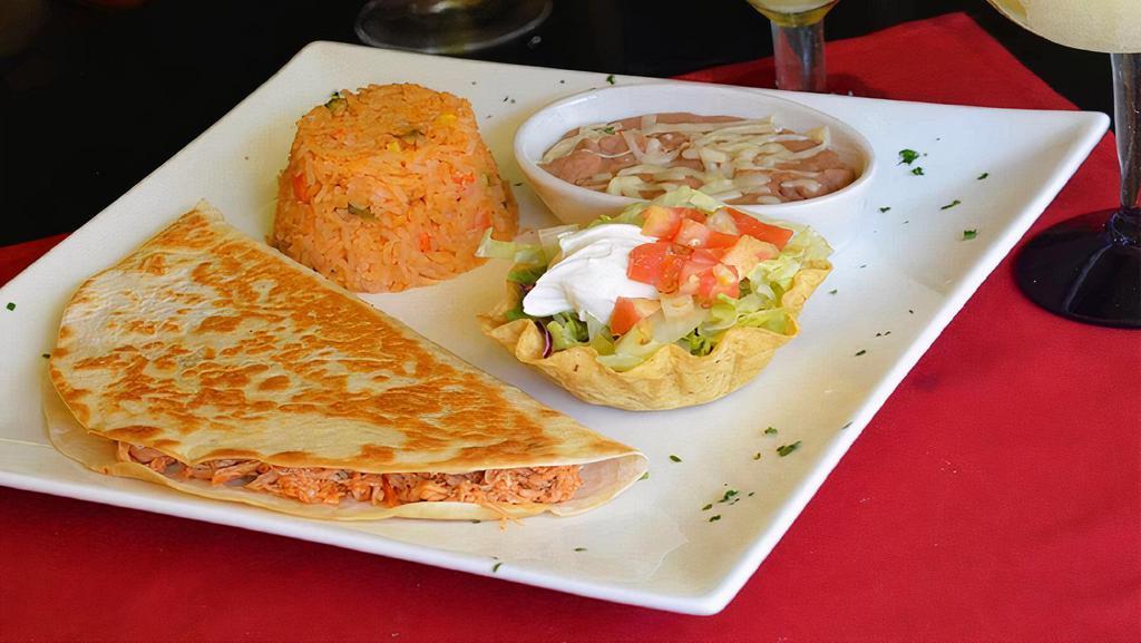 Simply Quesadilla · We stuffed our cheese quesadilla with your choice of ground beef or chicken. Served with rice, beans and crema salad.
