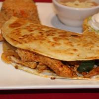 Fajita Quesadilla Grande · Large flour tortilla filled with cheese, marinated strips of meat, onions, bell peppers, and...