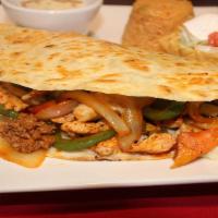 Quesadilla A La Mexicana · Large flour tortilla filled with chicken and chorizo (Mexican sausage) with onions, bell pep...