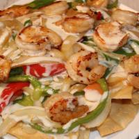 Shrimp Fajita Nachos · A bed of crispy nachos topped with grilled shrimp, bell peppers, onions, tomatoes, lettuce, ...