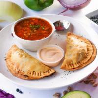 Lunch  Empanadas · Two lightly breaded, flaky pastries stuffed with chicken or beef. Served with soup or salad.