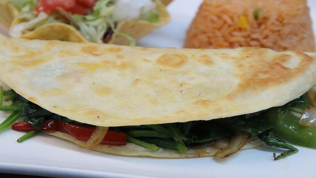 Lunch Spinach Quesadilla · Cheese quesadilla with grilled bell peppers, onions, tomatoes and spinach. Served with rice, lettuce, tomatoes, and sour cream.
