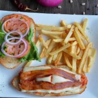 New Chicken Club · Grilled boneless chicken breast topped with crispy bacon, swiss cheese, lettuce, and tomato.