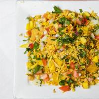 Bhel Puri · Fine mix of crisp flour and puffed rice with chopped onions, green Chilli, diced tomatoes an...