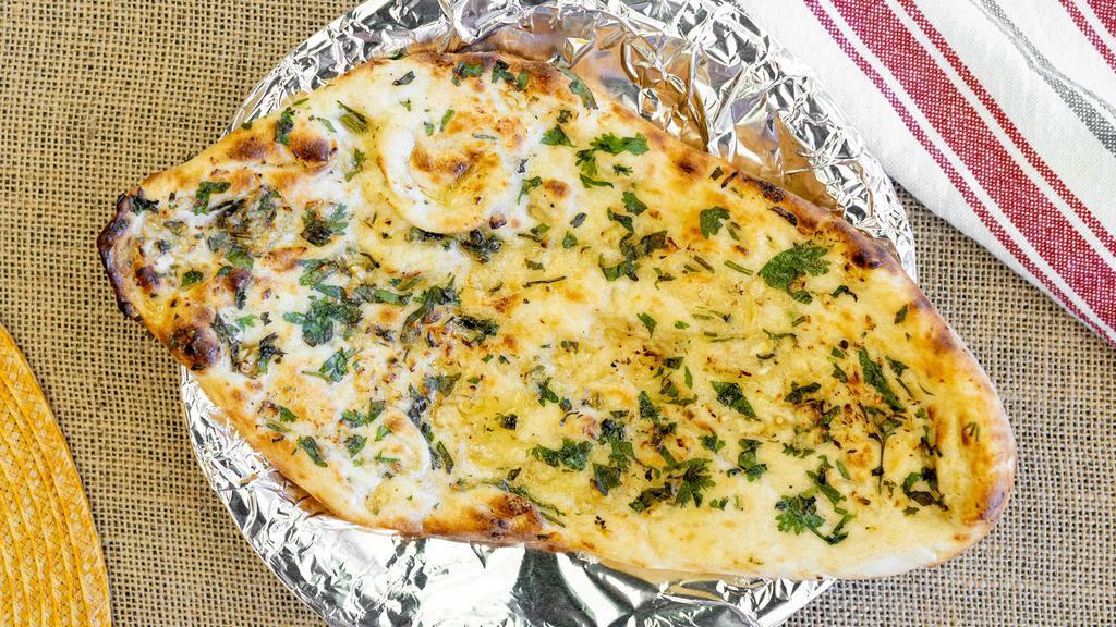Garlic Naan · A bread made of white flour topped with fresh minced garlic.