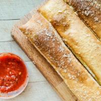 Bread Stix · Fresh baked stix brushed with garlic herb sauce and topped with grated Parmesan cheese