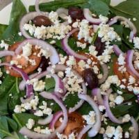 Spinach Salad · Baby spinach, tomatoes, red onions, Kalamata olives & goat cheese