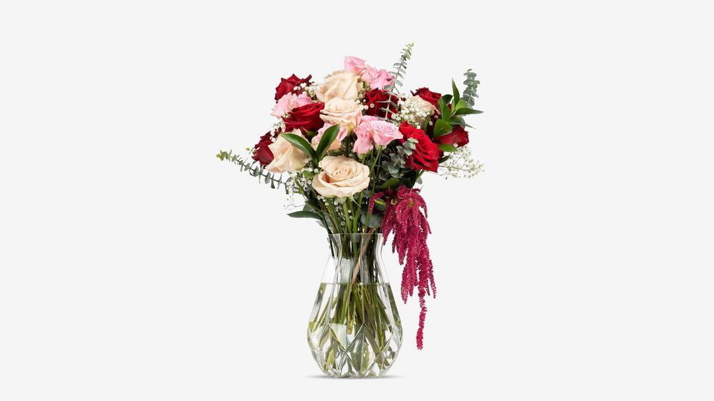 La Vie En Rose · Life is rosy! Arrangement includes a dozen and a half roses, hanging amaranthus, gypsy, eucalyptus, and ruscus. Slight color options are available upon request.