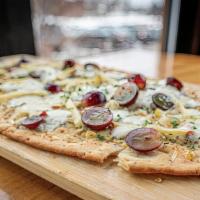 Grape & Apple · flatbread brushed with oil then topped with
herbs, grapes, apples, mozzarella & blue cheese,...