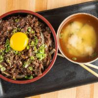Bulgogi Don · Marinated beef, onion scallion over bed of rice and egg on top