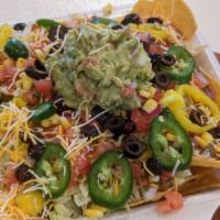 Loaded Nachos · House made tortilla chips with protein and fresh toppings of your choice.