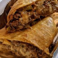 Steak & Cheese Fried Burrito · Premium Diced Steak, Melted Monterey Jack and Cheddar Cheese Blend, with Grilled Peppers and...