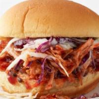 Pulled Pork Sandwich · Slow roasted BBQ pork piled high on our signature roll, served with our house coleslaw on a ...