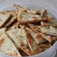 Naan Chips Dip · Oven-baked naan chips, made from an Indian flatbread similar to pita, are great for dipping ...