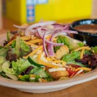 Garden Salad · Mixed greens, tomato, cucumber, onion, croutons, and cheddar jack blend.