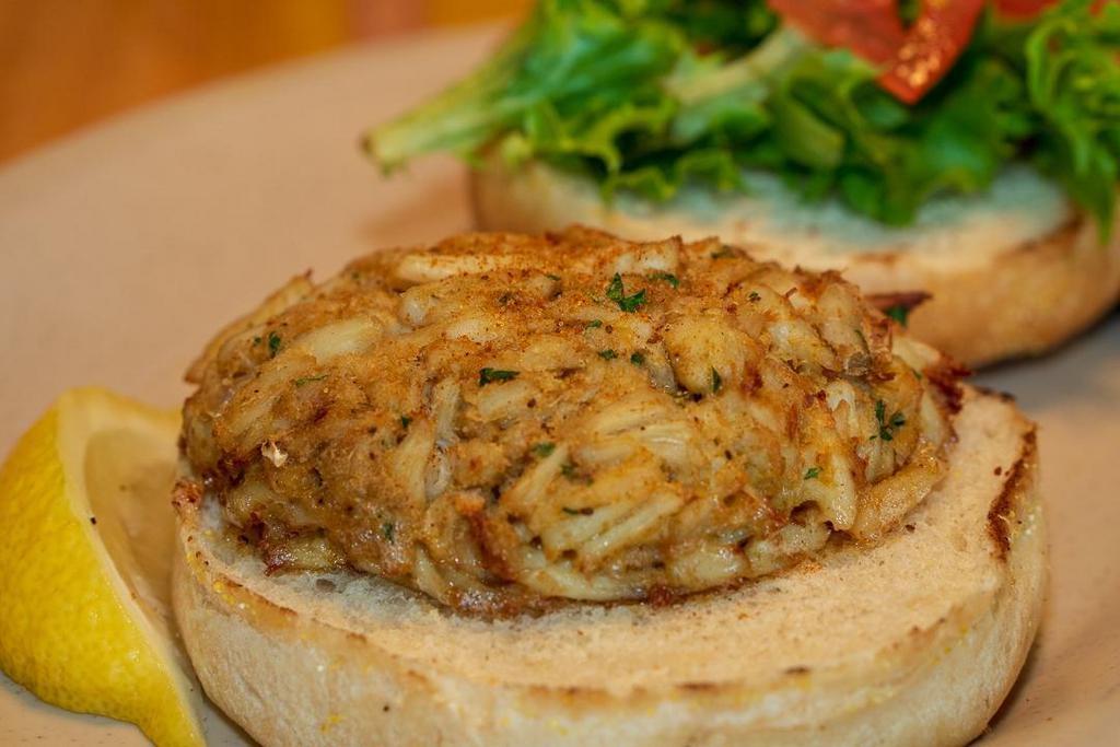 Crab Cake Sammy · Housemade lump crab cake, mixed greens, tomato and on a kaiser.