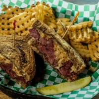Reuben · Grilled rye bread, melted swiss cheese, sauerkraut, tender oven-baked shredded corned beef a...