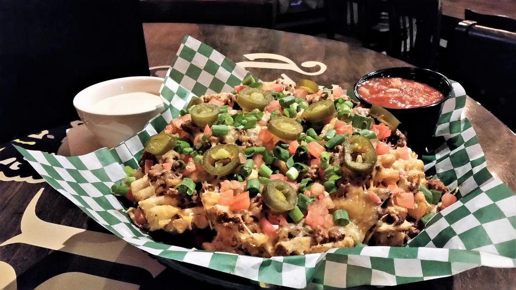 Irish Nachos · Waffle fries topped with seasoned beef or chicken, melted jack-cheddar cheese, tomatoes, jalapenos and green onion. Served with Dublin dip and salsa.