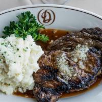 Rib-Eye 16 Oz · USDA Prime.  Steaks are topped with our signature steak butter.  Served with garlic mashed p...