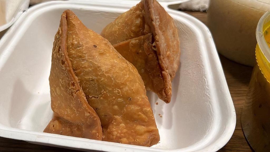 Vegetable Samosa · Mix vegetables stuffed, wrapped in flour pastry and deep fried.